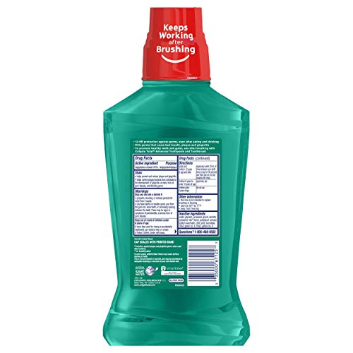 Colgate Total Pro-Shield Mouthwash on bathroom counter with toothbrush