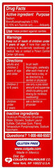 Close-up of Colgate Cavity Protection toothpaste tube with fluoride label
