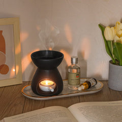 Two black ceramic oil burners with glossy glaze