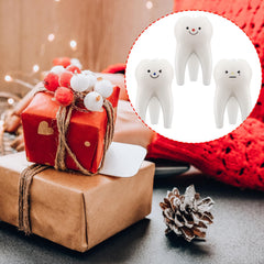 Conelist tooth candle vanilla trio on desk illustrates stylish dental office decor