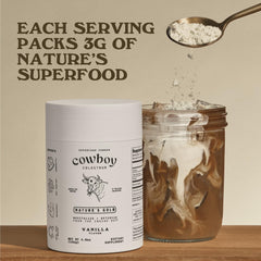Cowboy Colostrum powder scoop in glass showing easy daily mixing.