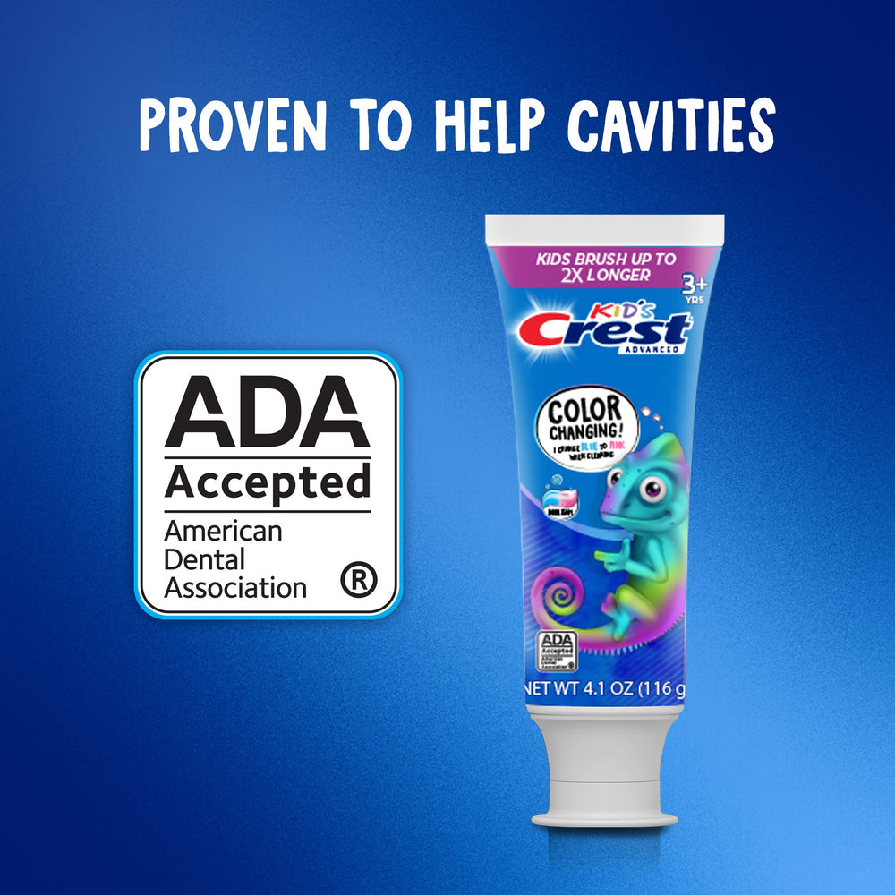 Smiling child brushing with Crest Chameleon toothpaste