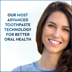 Toothpaste applying near gum line to neutralize plaque bacteria