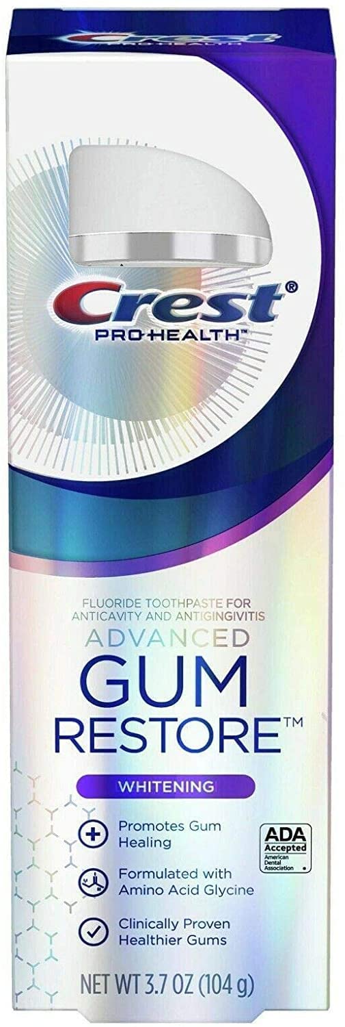 Close-up of whitening Crest toothpaste showing a bright smile