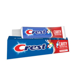 Three Crest toothpaste tubes side by side in a pack of 3