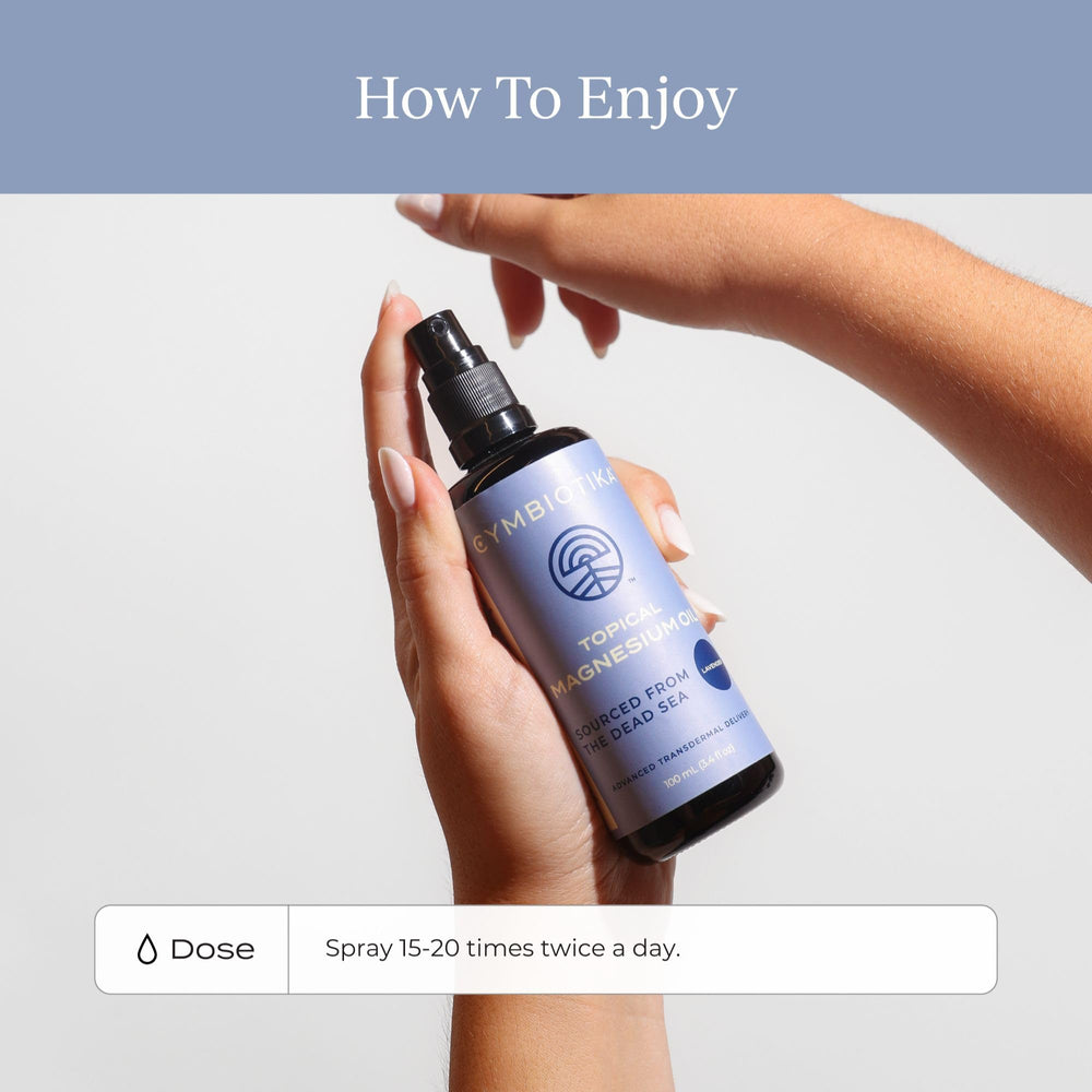 Applying magnesium oil spray to the leg