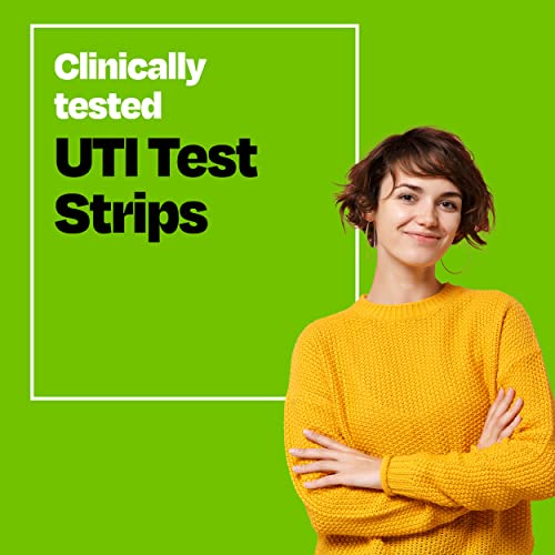 Hands using Cystex UTI test strips with a clean grip handle