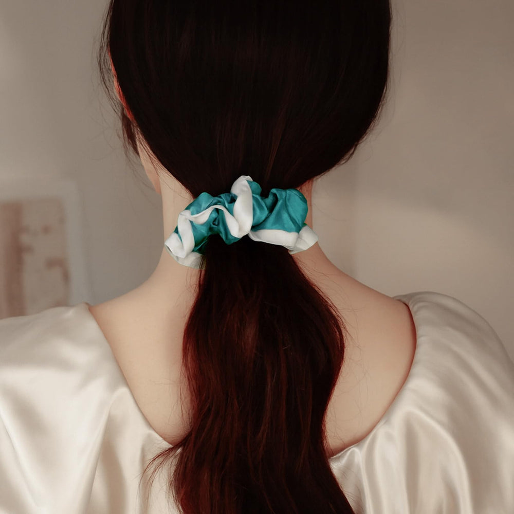 DAISYSILK silk bun holder in Aqua Green for neat updo.