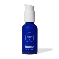Dame Arousal Serum bottle displayed with natural earthy background