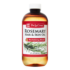 De La Cruz Rosemary Oil Blend bottle pour for easy application and hydration.