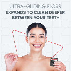 Close-up of mint floss between teeth during use