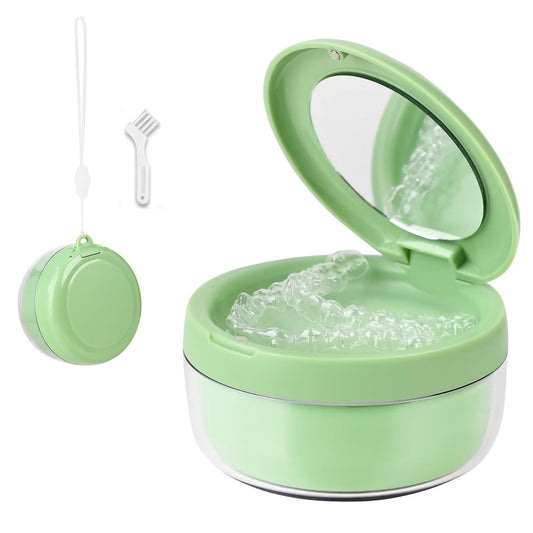 Green denture case showing upper storage tray and cleaning compartment