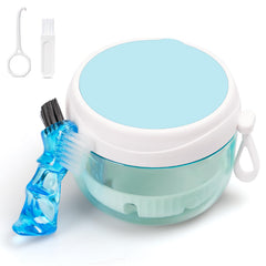 White denture travel case with mirror and built-in denture brush