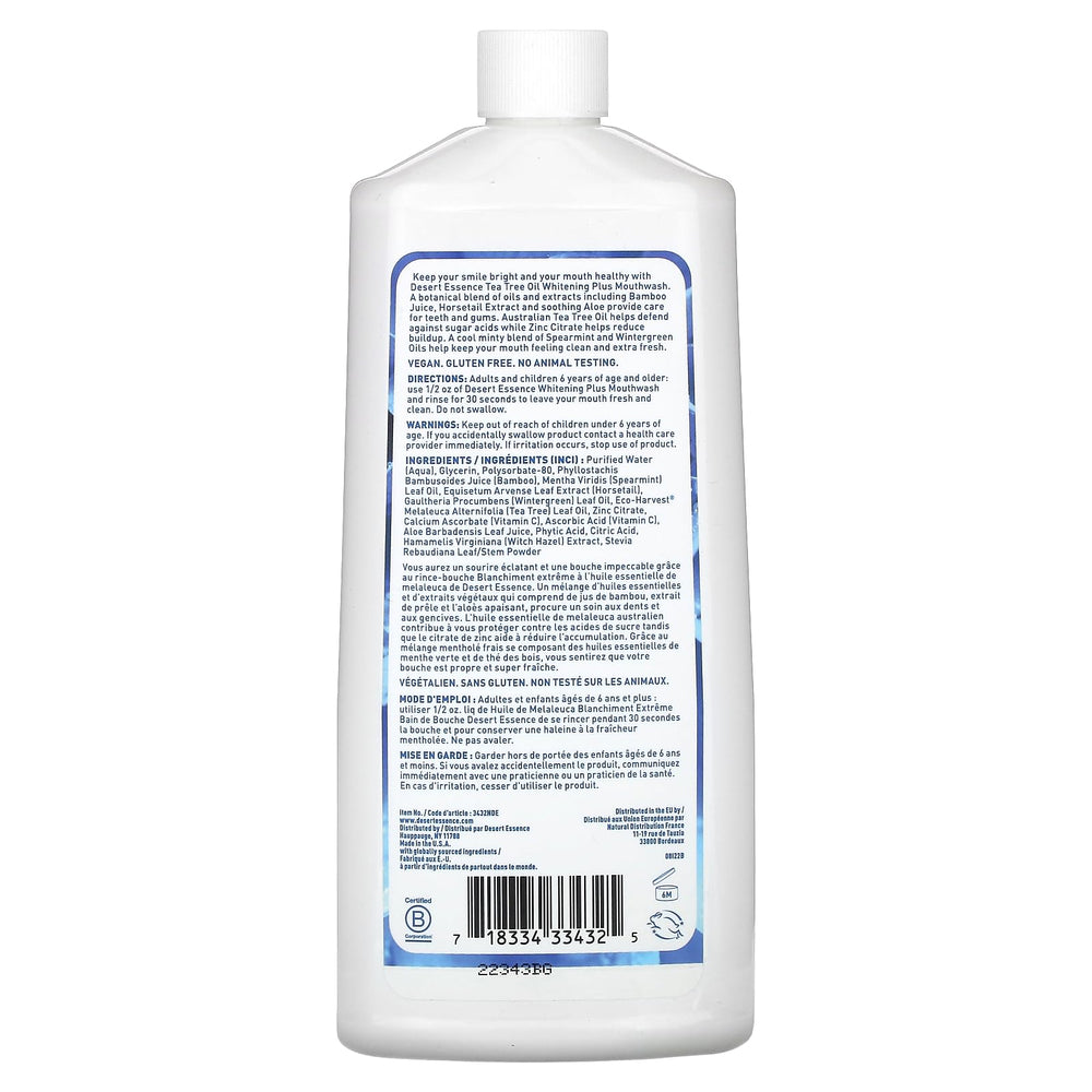 Front view of Desert Essence Tea Tree Whitening Mint Mouthwash bottle with packaging 16 oz