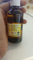 Side view of Styrax essential oil bottle with cap