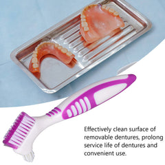 Pink plastic handle of denture brush