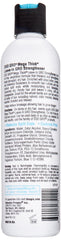 Hands applying DOO GRO Mega Thick Strengthener Leave-in to hair for nourished ends