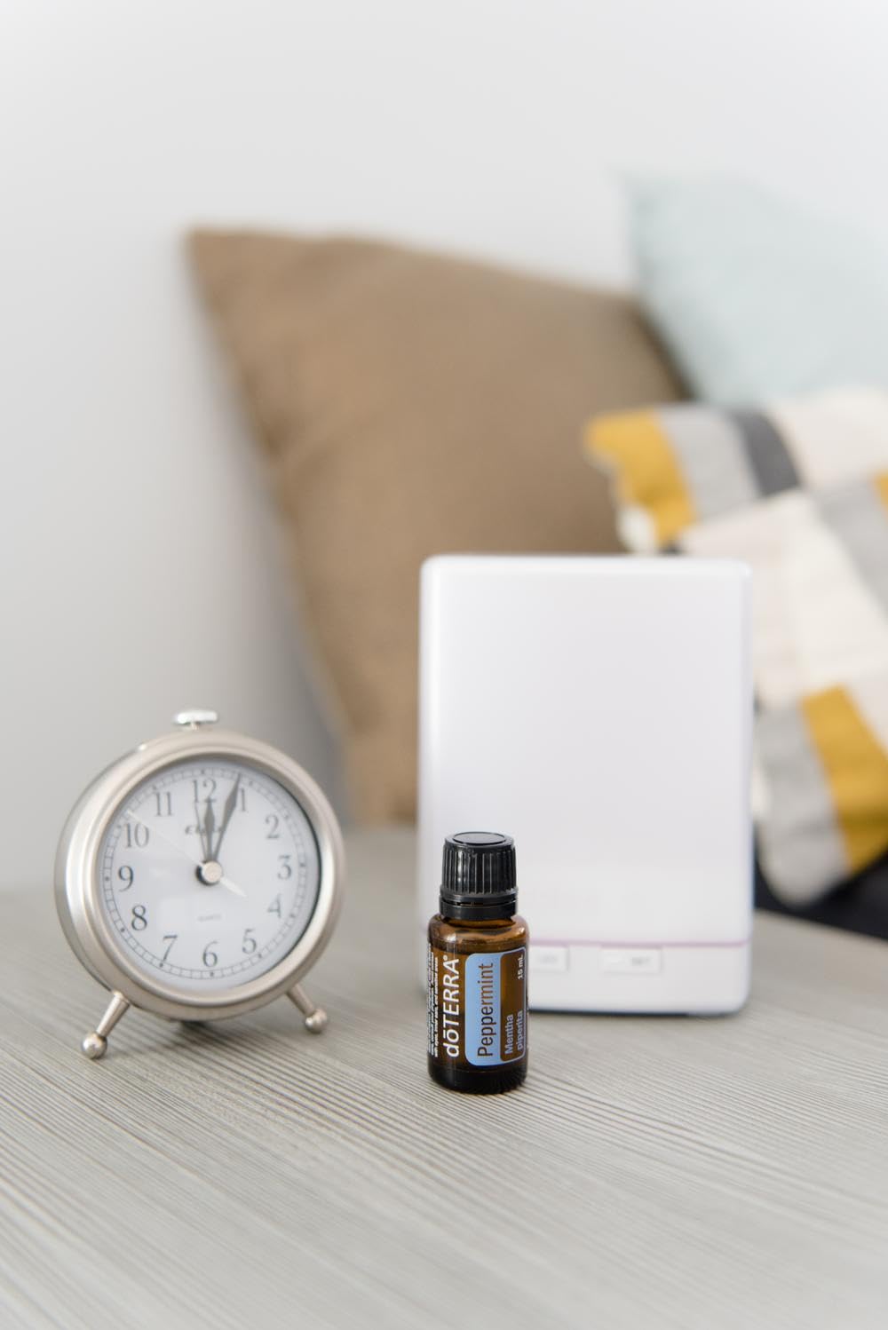Peppermint oil bottle with dropper on white background