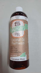 Mint-flavored coconut oil pulling mouthwash bottle close-up