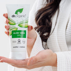 Hands applying Dr Organic Aloe Vera Gel 200ml