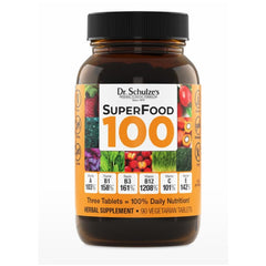 Dr. Schulze's SuperFood 100 bottle close-up showing plant-based nutrition for daily energy.