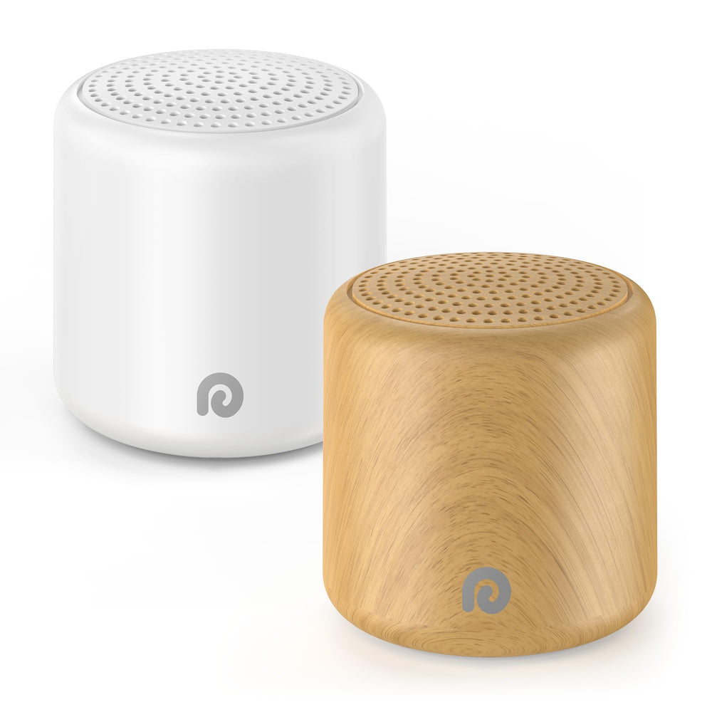 Dreamegg travel white noise machine in hand shows egg-size portability for travel comfort.
