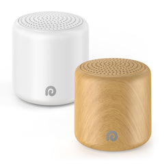 Dreamegg travel white noise machine in hand shows egg-size portability for travel comfort.