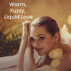 Chocolate-warming massage oil bottle on wooden surface