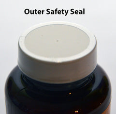 Side view of Queen's Delight bottle on a wooden surface