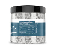 Earthborn Elements Vitamin C + Zinc Gluconate capsules close-up on white background