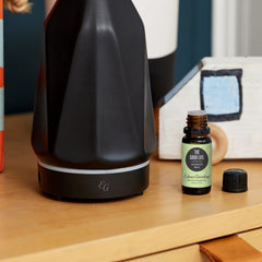Amber glass bottle of Edens Garden The Good Life essential oil blend with dropper