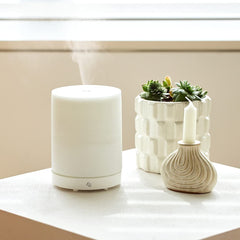 Edens Garden Pearl Diffuser side view fits neatly on a nightstand for calm evenings