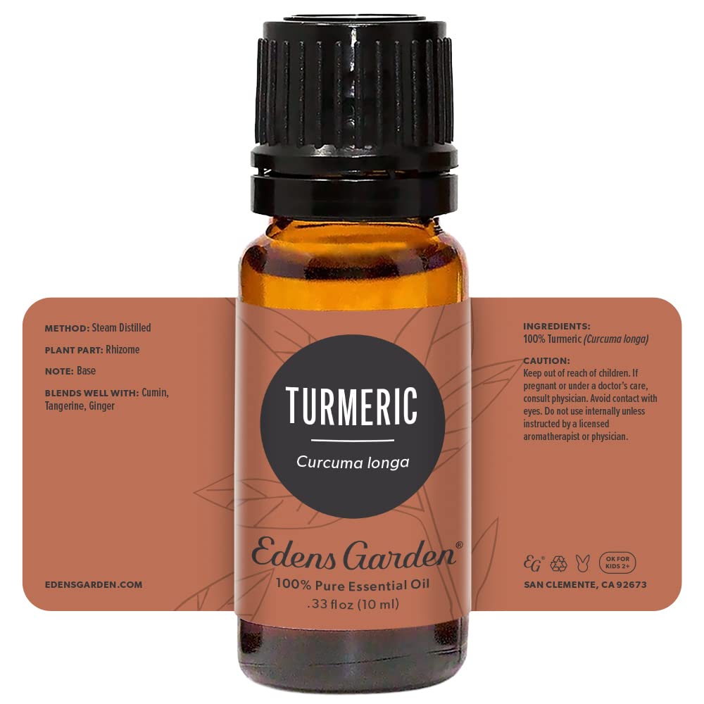 Turmeric essential oil bottle with diffuser in the background