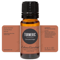 Turmeric essential oil bottle with diffuser in the background