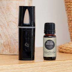 Close-up of vanilla sandalwood essential oil blend bottle with label