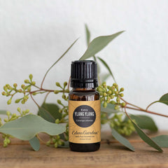 Close-up of amber glass bottle for Ylang Ylang Extra essential oil