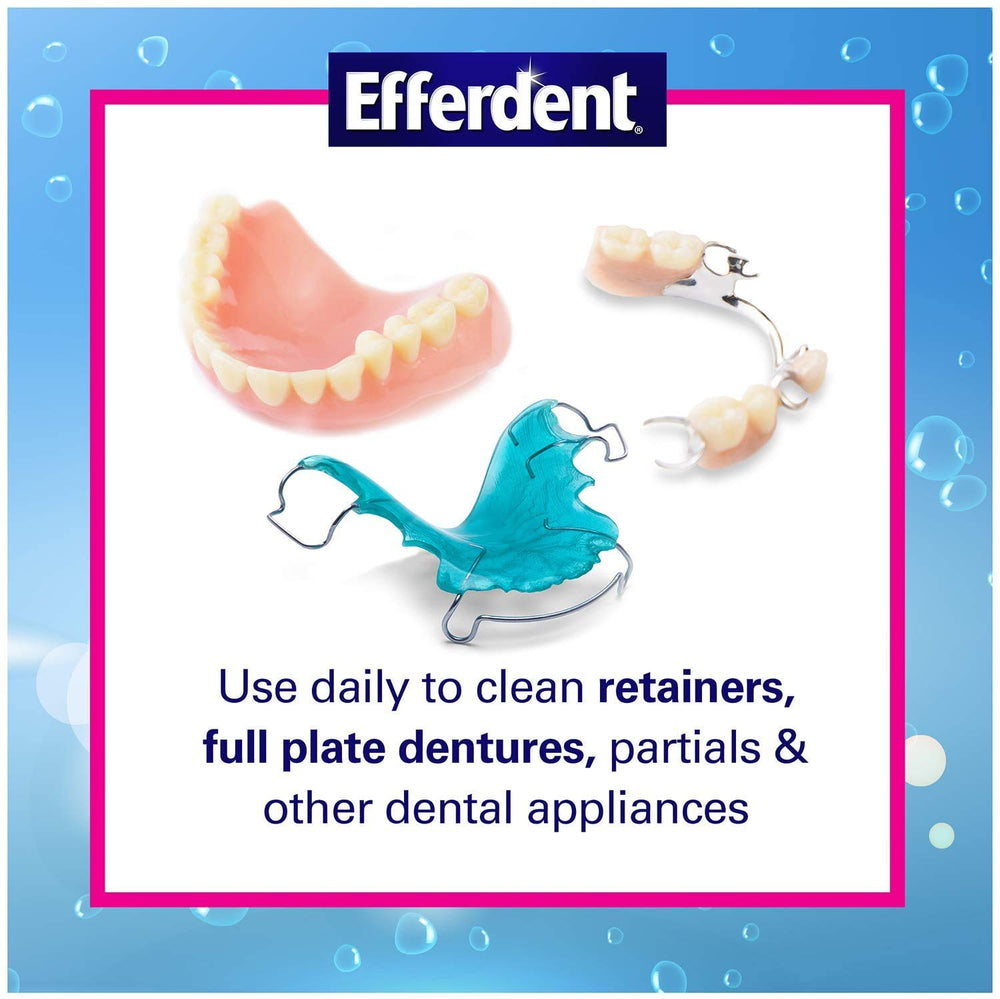 Denture soaking in cup with water using Efferdent Cleanser