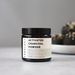 Applying activated charcoal powder in a facial mask