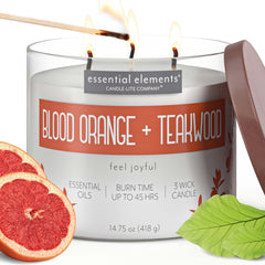 Essential Elements Blood Orange Teakwood candle side view emitting vibrant citrus aroma for any space