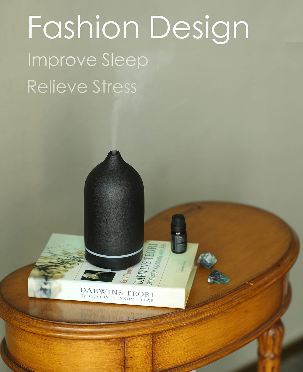 Diffuser on a surface with timer settings and mist