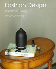 Diffuser on a surface with timer settings and mist