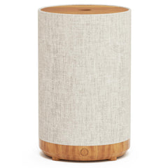 SNOWSEN 120ml essential oil diffuser with fabric cover and wood grain base.