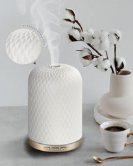 White Onaboviva essential oil diffuser with ceramic cover, front view
