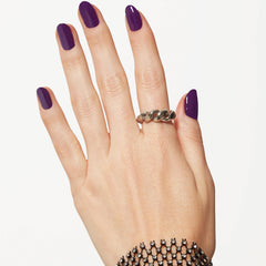 essie Underground Ball shown under different lighting to reveal red undertones.