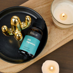 Premium, phthalate-free fragrance oil by ESSLUX in amber bottle