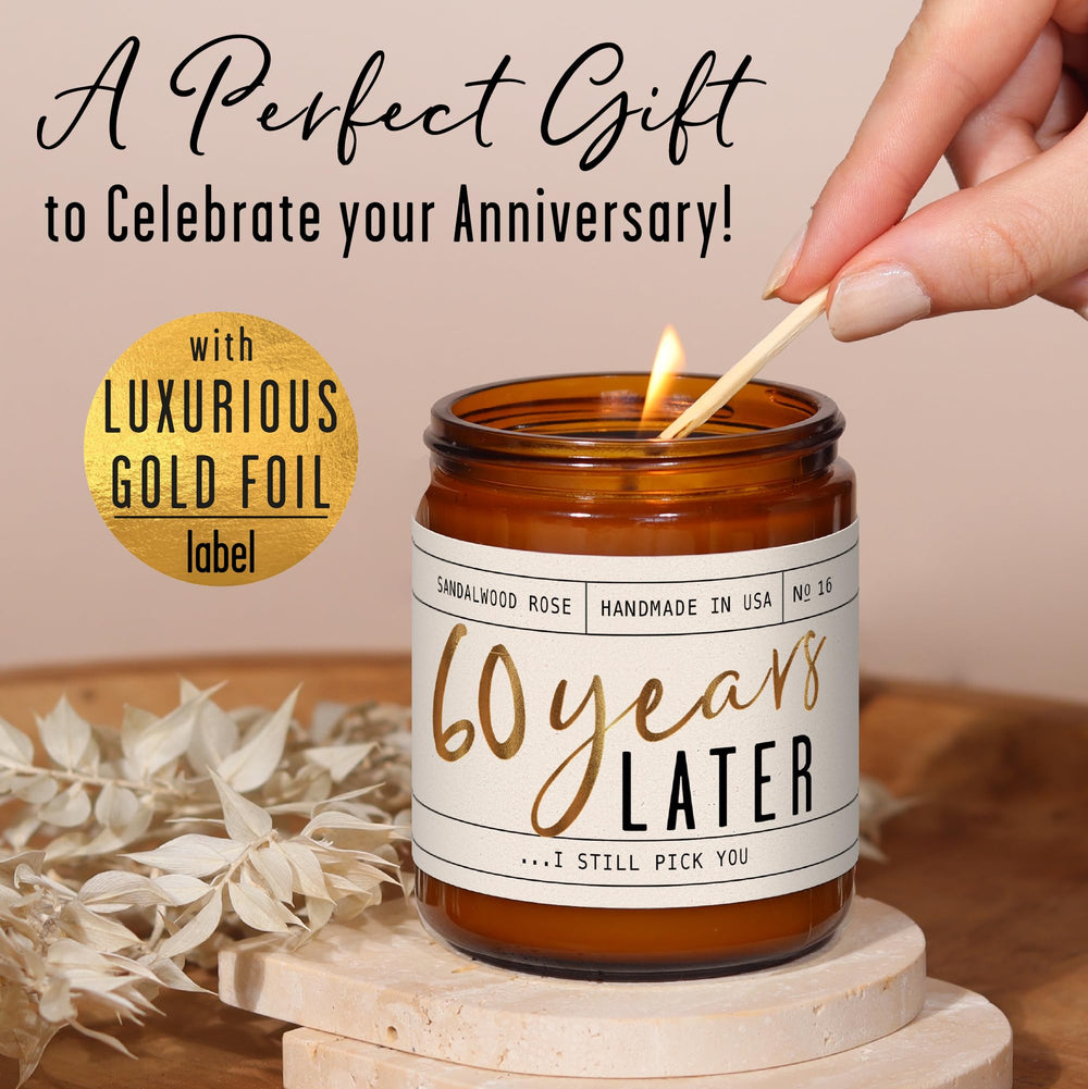 Candle with etched gold-foil message '60 Year Later'