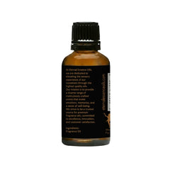 Close-up of amber glass bottle and dropper for Leather Ombré fragrance oil by Eternal Essence Oils