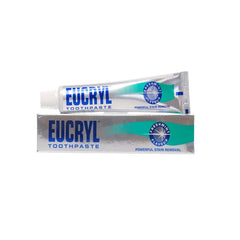 Smiling person showcasing brighter teeth after using Eucryl Freshmint toothpaste