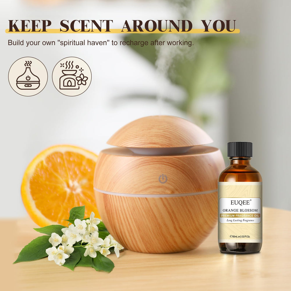 Dropper dispensing EUQEE Orange Blossom fragrance oil into diffuser