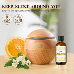 Dropper dispensing EUQEE Orange Blossom fragrance oil into diffuser
